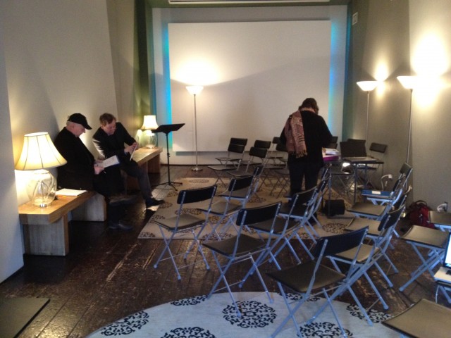 John McCann, Richard Evans, and Liz Dreyer of EmcArts prepare the room.